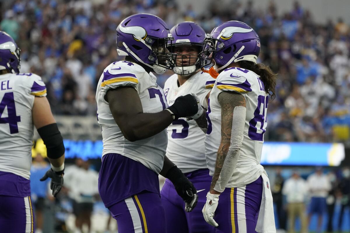 Minnesota Vikings players celebrate after scoring a touchdown in the second half against the Chargers.