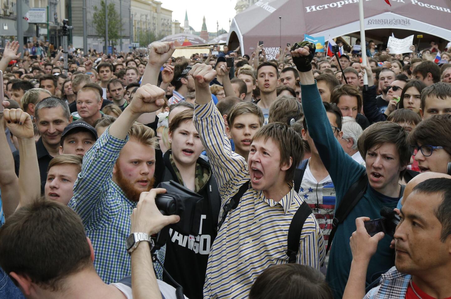 Protesters shout out and gesture during a demonstration in downtown Moscow. Russian opposition leader Alexei Navalny, aiming to repeat the nationwide protests that rattled the Kremlin three months ago, has called for a last-minute location change for a Moscow demonstration that could provoke confrontations with police.