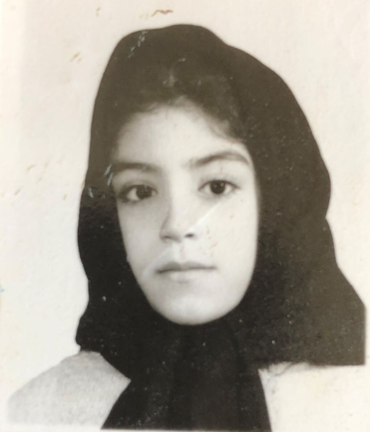 Afsoon Johnston, whose maiden name is Roshanzamir, is shown in a third-grade photo in Tehran, Iran.