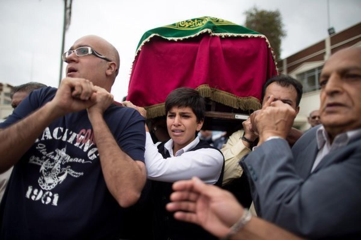 A coffin is carried during a funeral procession for Selima Merali, 41, and her daughter Nuriana, 15, who were killed in the Westgate mall attack in Nairobi, Kenya.