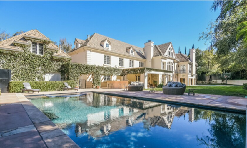 The two-story home holds six bedrooms, nine bathrooms, a movie theater and attic in over 10,000 square feet.
