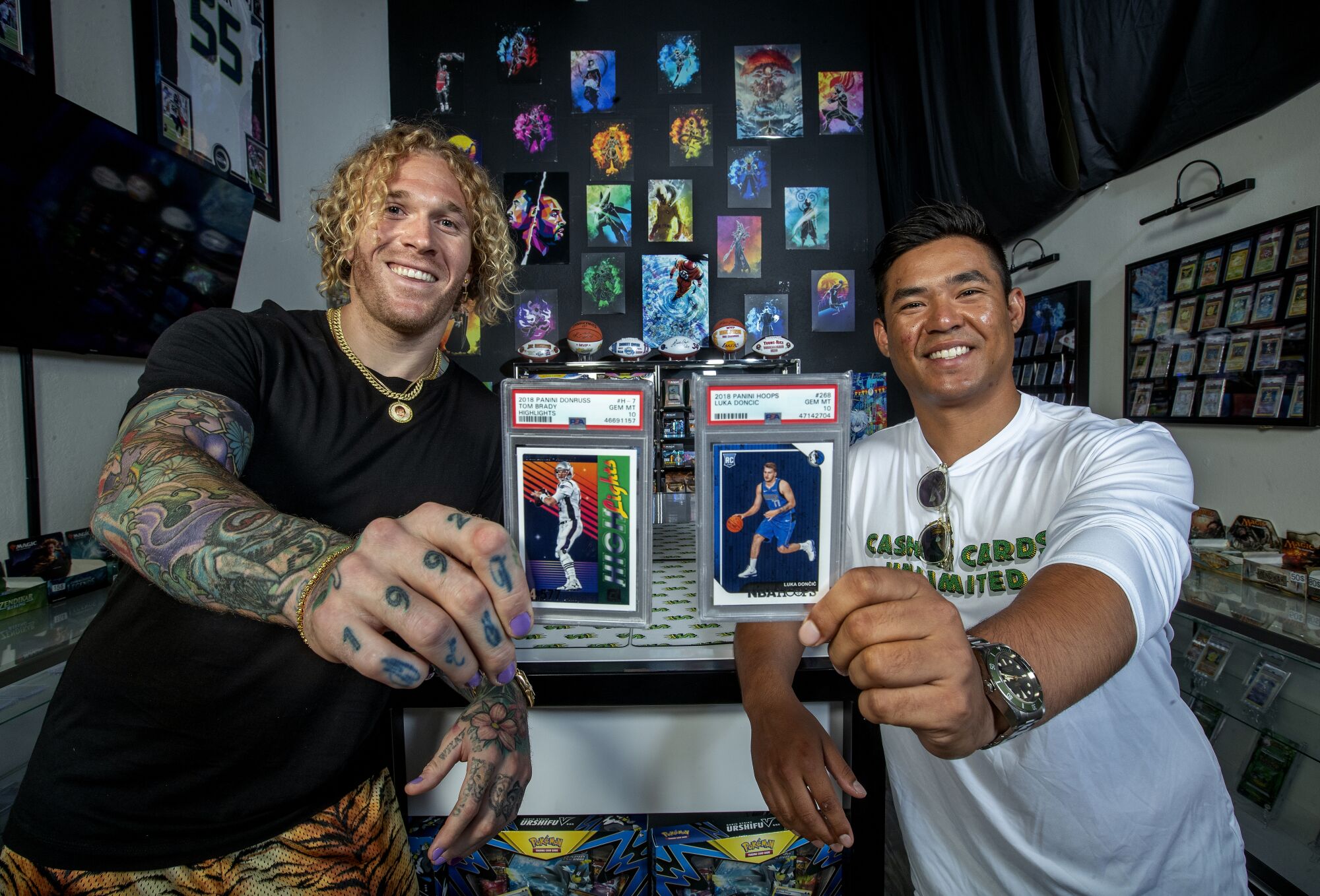 Cassius Marsh, left, and friend Nick Nugwynne, co-founders of Cash Cards Unlimited, are photographed inside their business.