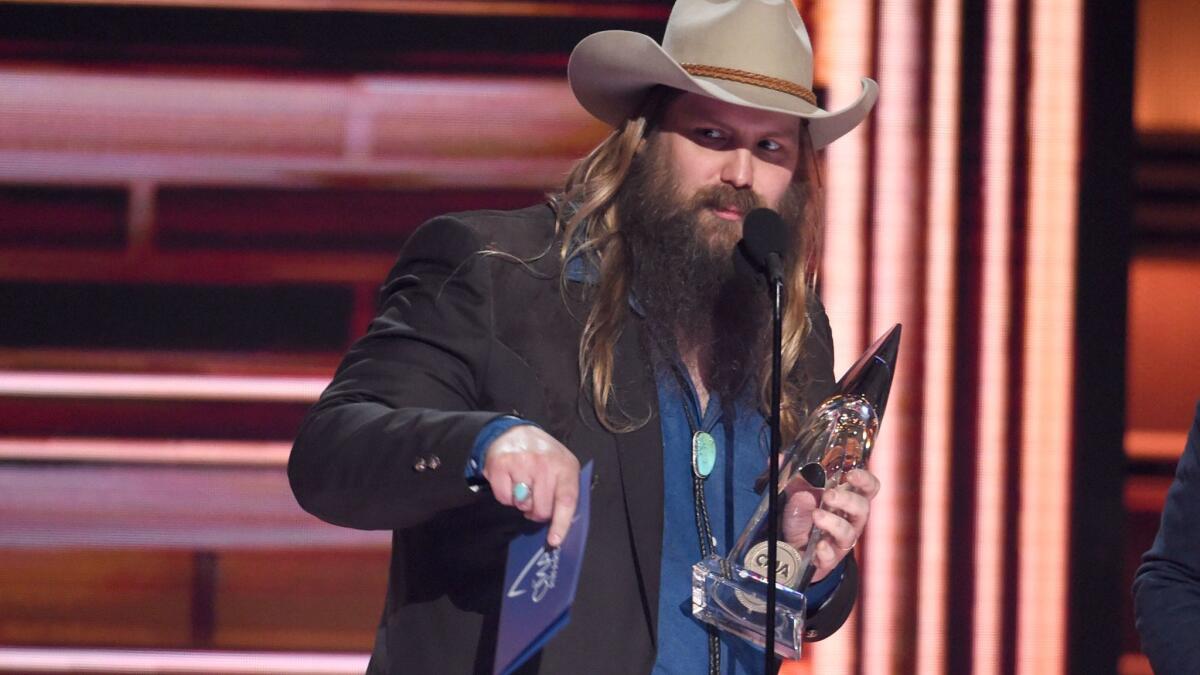 Chris Stapleton accepts the album of the year award at the CMA Awards.