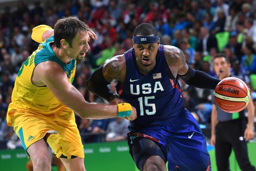 U.S. forward Carmelo Anthony drives by Australia center David Andersen during a men's Group A basketball game at the Carioca Arena 1 on Aug. 10.