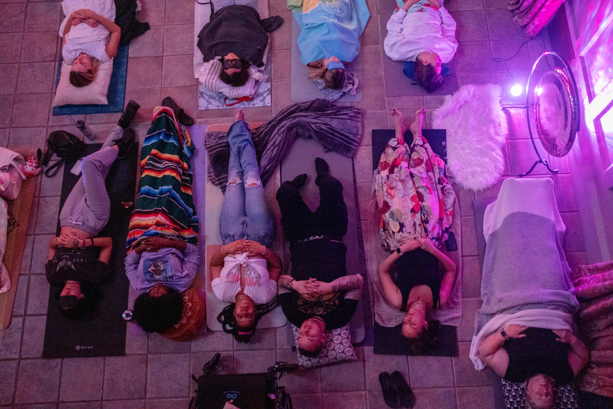 Guests lie on the floor as they relax during a sound bath event at the First Congregational Church of Los Angeles.