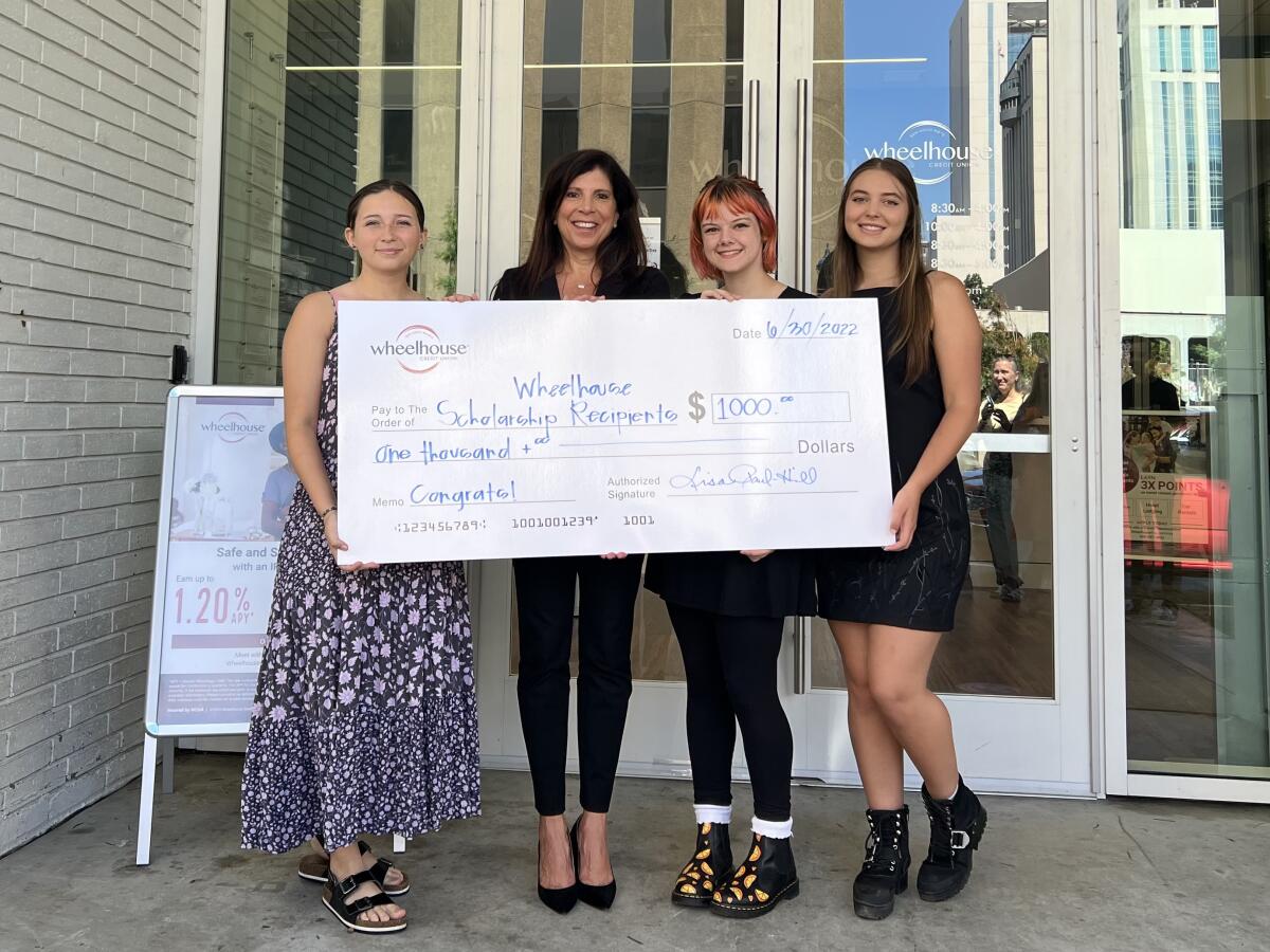 Wheelhouse President/CEO Lisa Paul-Hill (second from left) and students Ember Yanez, Alyssa Sutherland and Alaina Austin.