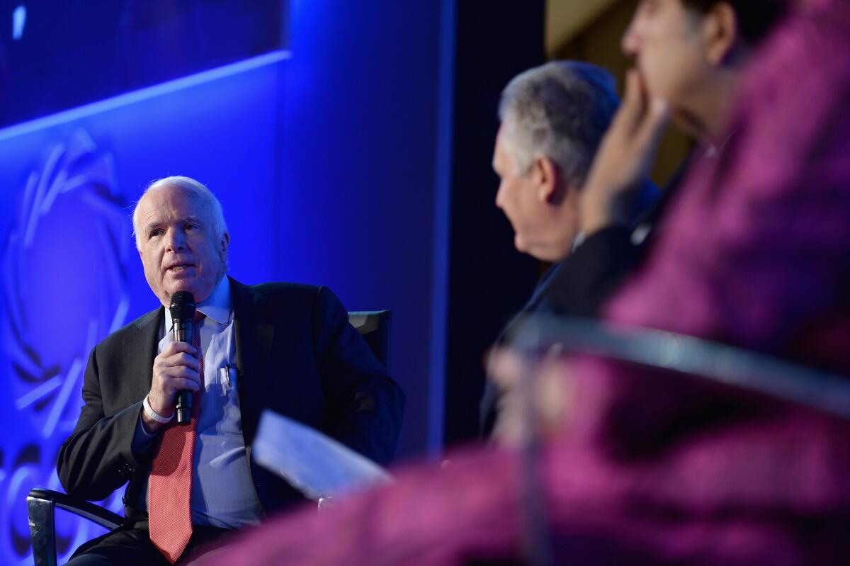 U.S. Sen. John McCain (R-Ariz.) speaks in New York on Monday. He has endorsed gang prosecutor Elan Carr for Congress.
