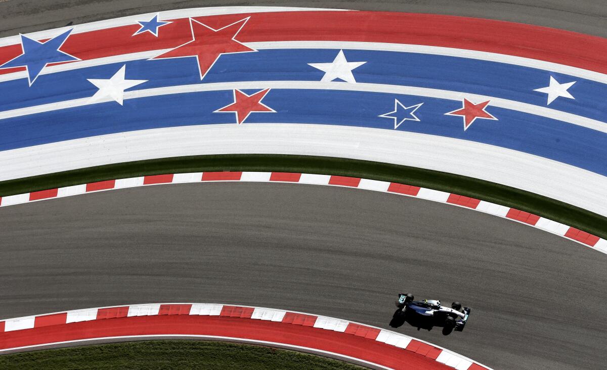 FILE - Mercedes driver Nico Rosberg, of Germany, drives through the course during the first practice session for the Formula One U.S. Grand Prix auto race at the Circuit of the Americas in Austin, Texas, in this Friday, Oct. 31, 2014, file photo. When Formula One returned to the United States in 2012, in central Texas of all places, the world's highest class of international auto racing took a big leap just to make a footprint in a country it had abandoned five years earlier. A decade later, F1 is here to stay in the USA. (AP Photo/Eric Gay, File)