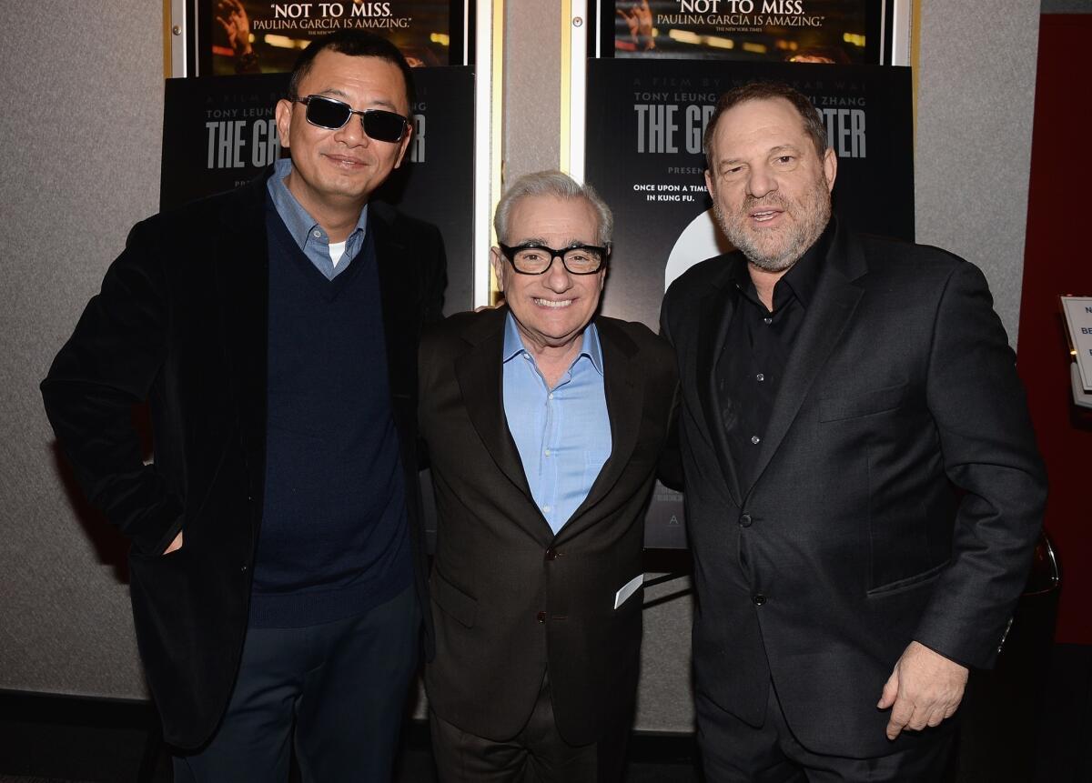 Director Wong Kar Wai, left, director Martin Scorsese and producer Harvey Weinstein attend a Q&A; and reception in honor of Wong at Lighthouse International Theater in New York.