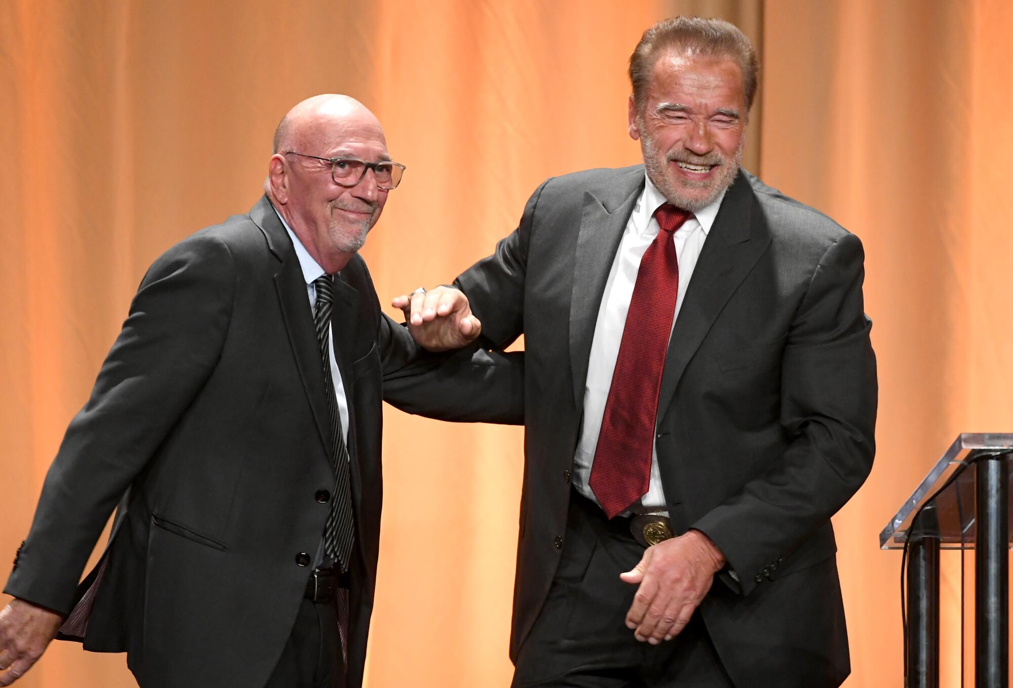 Hollywood Foreign Press Assn. President Lorenzo Soria, left, and Arnold Schwarzenegger.