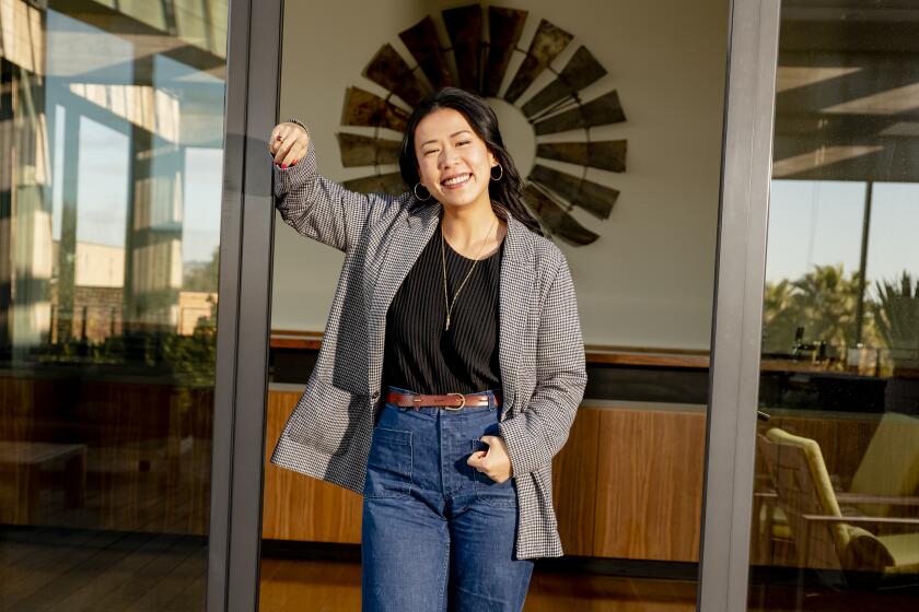 EMERYVILLE, CA - MARCH 4, 2022: Director of Pixar's "Turning Red" Domee Shi poses for a portrait at the Pixar HQ in Emeryville, CA on March 4, 2022. "Turning Red" is about a 13-year old girl named Meilin who learns about her family's unique history after waking up one morning transformed into a giant red panda. The coming-of-age story celebrates everything that comes with early adolescence - friendships, boy bands, big feelings, being embarrassed by a parent, your body going through changes you don't understand - and is set in Toronto in the early 2000s. It's a movie about a girl and her mother pushing and pulling against each other until they come to understand each other a little better. CREDIT: (Cayce Clifford / For The Times)