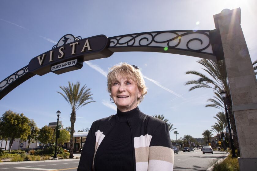 Vista, CA - February 02: Portrait of former Mayor and Council Member of the City of Vista Judy Ritter under one of the welcoming archways to downtown Vista on S. Santa Fe Avenue. (Charlie Neuman / For The San Diego Union-Tribune)