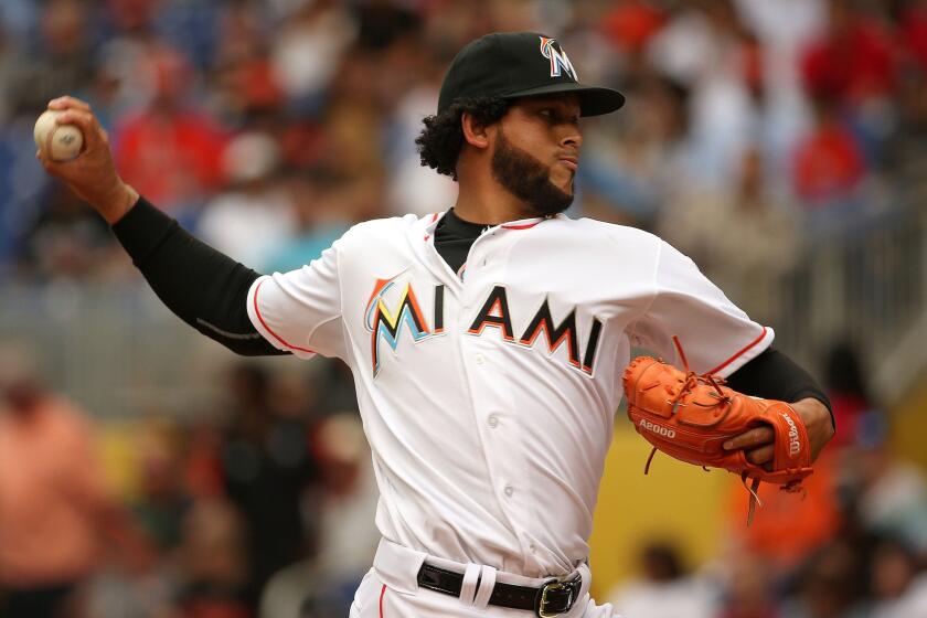 Marlins opening day starter Henderson Alvarez delivers a pitch against the Atlanta Braves.