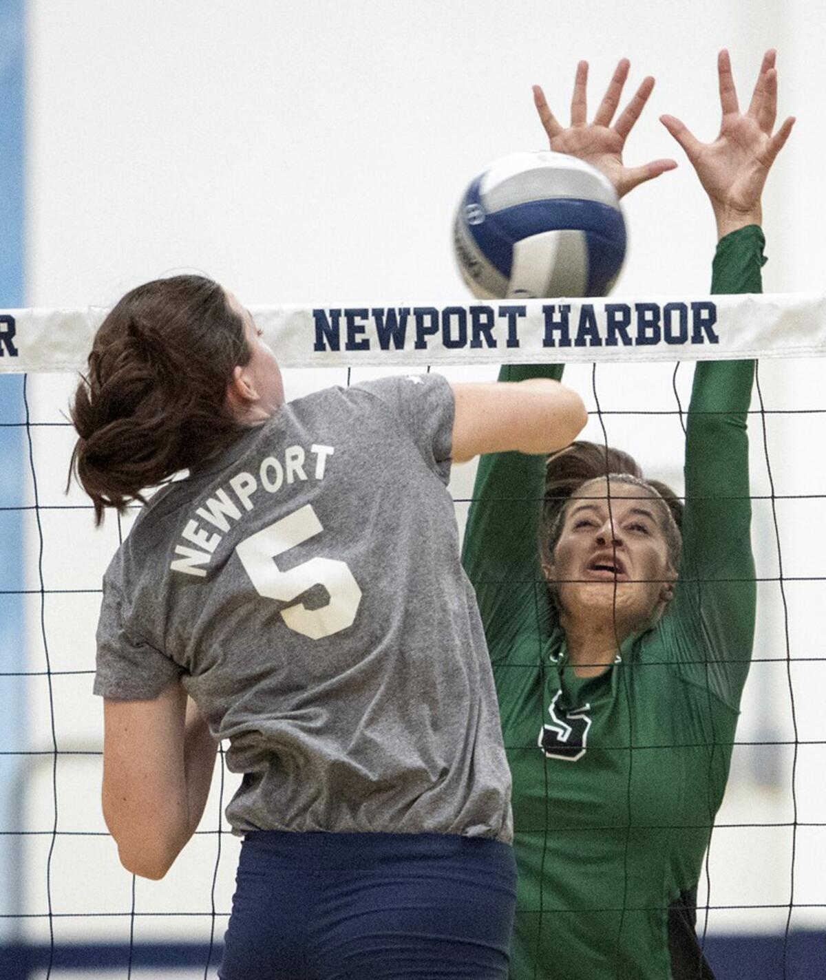 Newport Harbor's Anne O'Brien hits into Sage Hill's Zoe Mazakas in a nonleague match at home on Tuesday.
