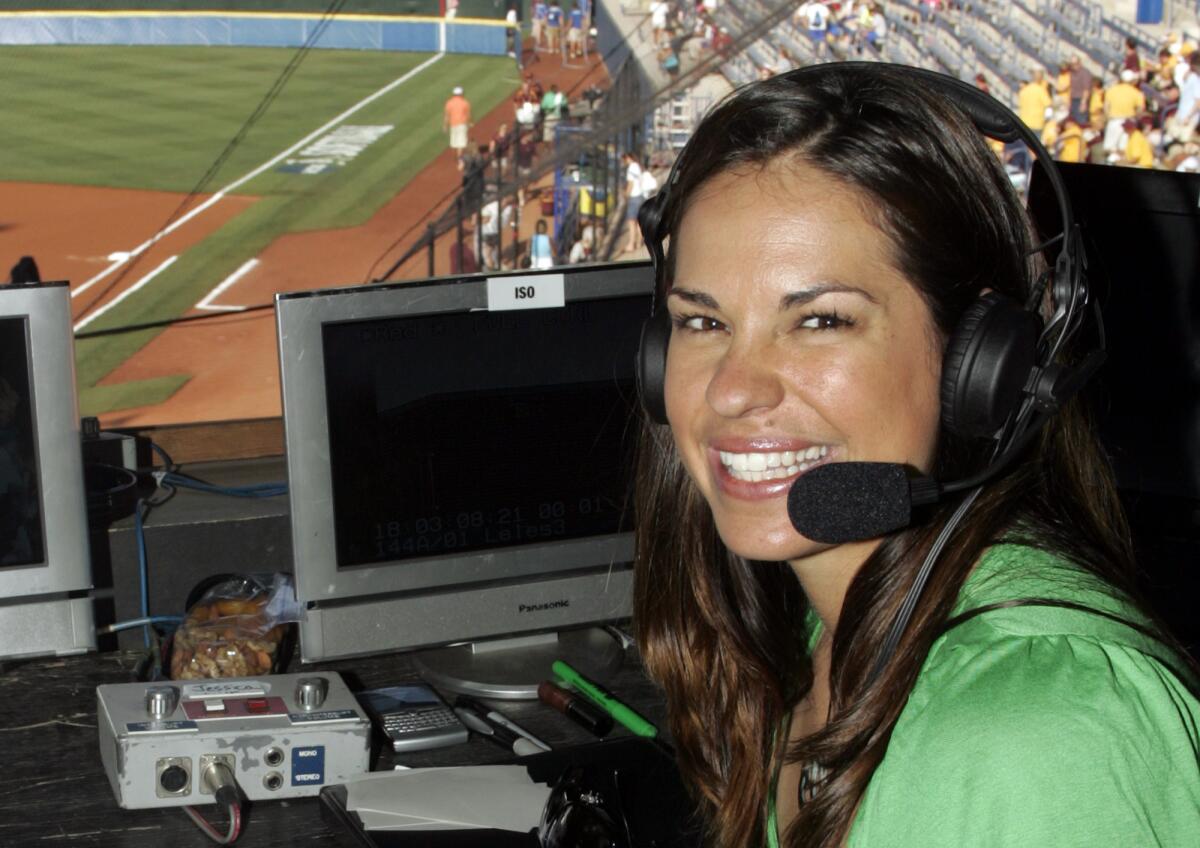 FILE - In this May 29, 2009, file photo, USA softball player Jessica Mendoza poses for a photo in the ESPN broadcast booth at the Women's College World Series in Oklahoma City. ESPN baseball analyst Jessica Mendoza tried to clarify her remarks about the Mike Fiers role in the sign-stealing scandal after criticizing Fiers earlier on a radio show. She said in a statement posted to Twitter that baseball will benefit from the sign stealing being uncovered and that appropriate action was taken. Mendoza's issue remains how it came forward. (AP Photo/File)