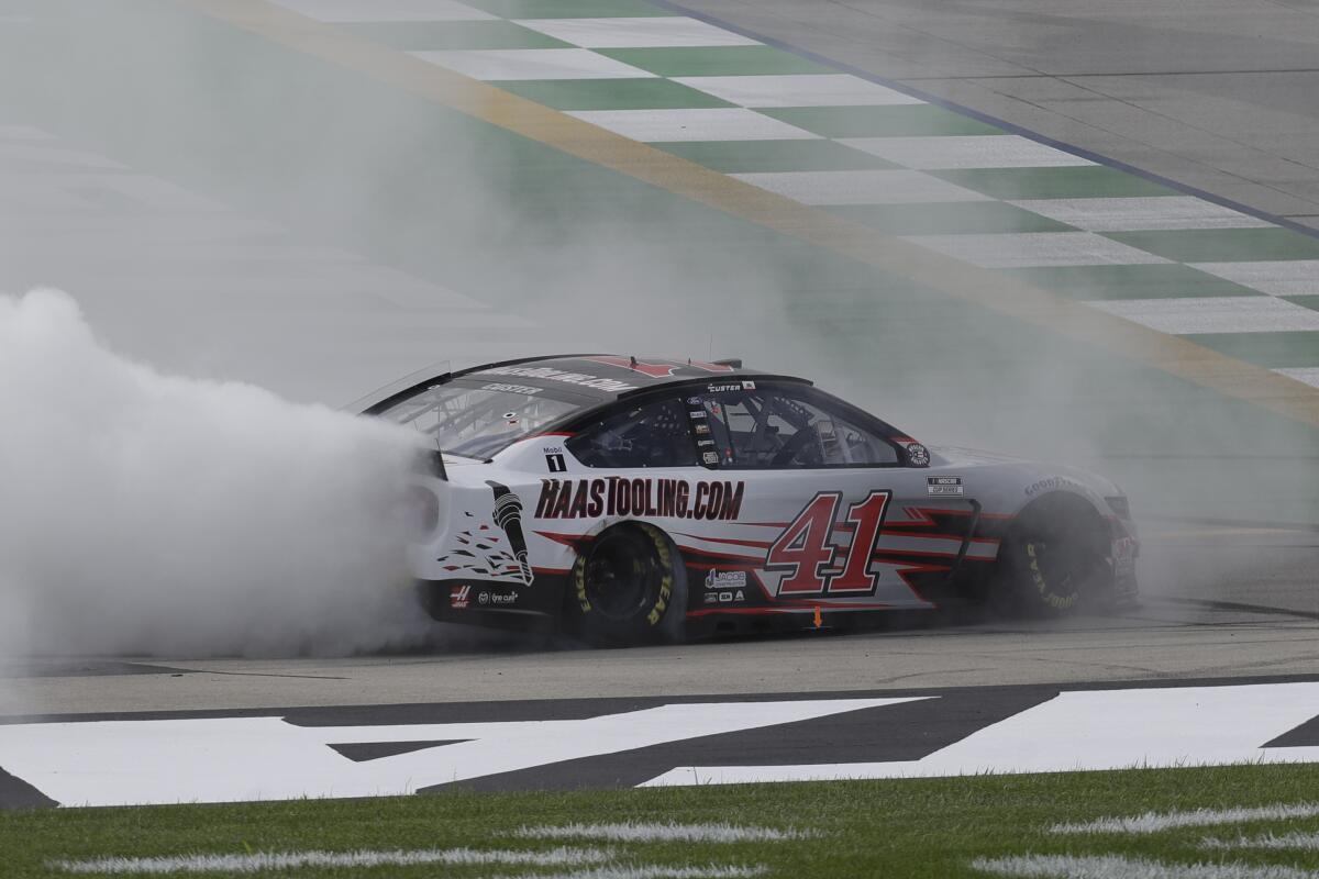 Cole Custer celebrates after winning a NASCAR Cup Series race on Sunday in Sparta, Ky.