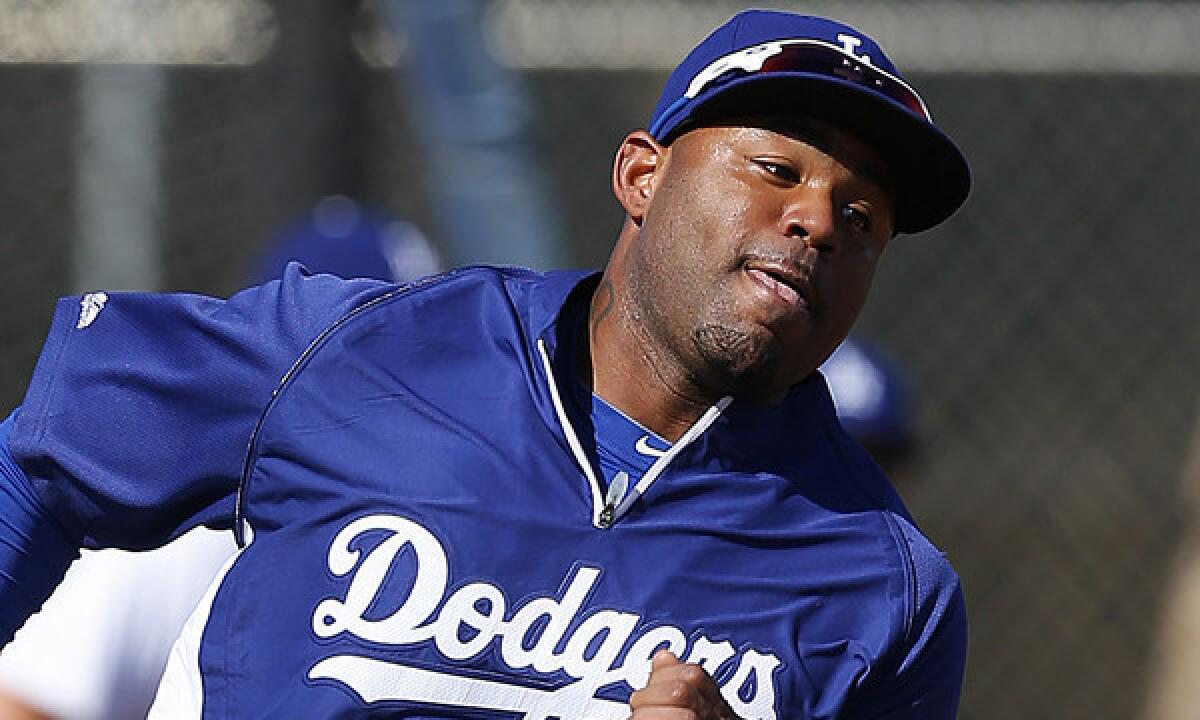 Dodgers outfielder Carl Crawford runs the bases during a spring training practice session Feb. 20. There's a chance Crawford might not play in the team's season-opening series in Australia.