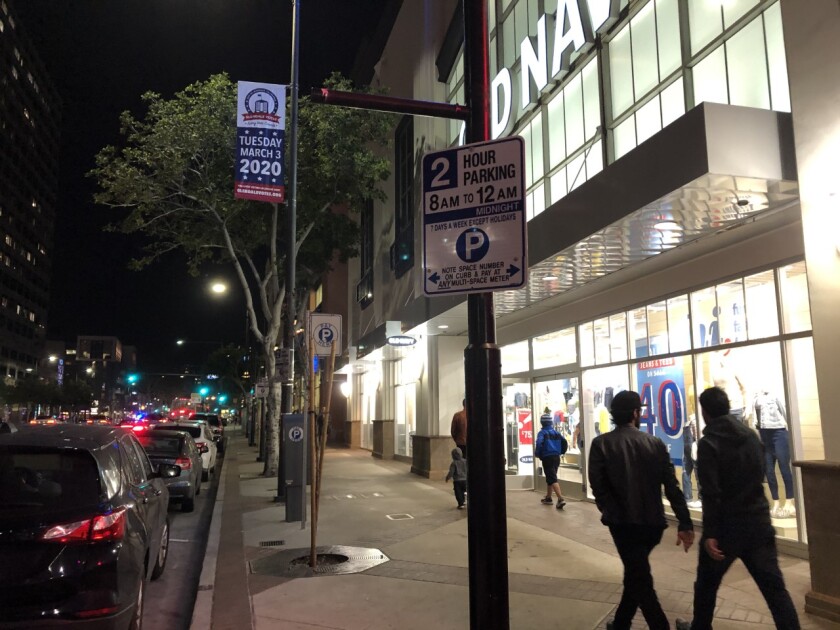 New signs along downtown Glendale's Brand Boulevard reflect that parking-enforcement hours now run until midnight. Currently, the city is issuing warnings for those who fail to feed the meter past 10 p.m., the former cutoff time.