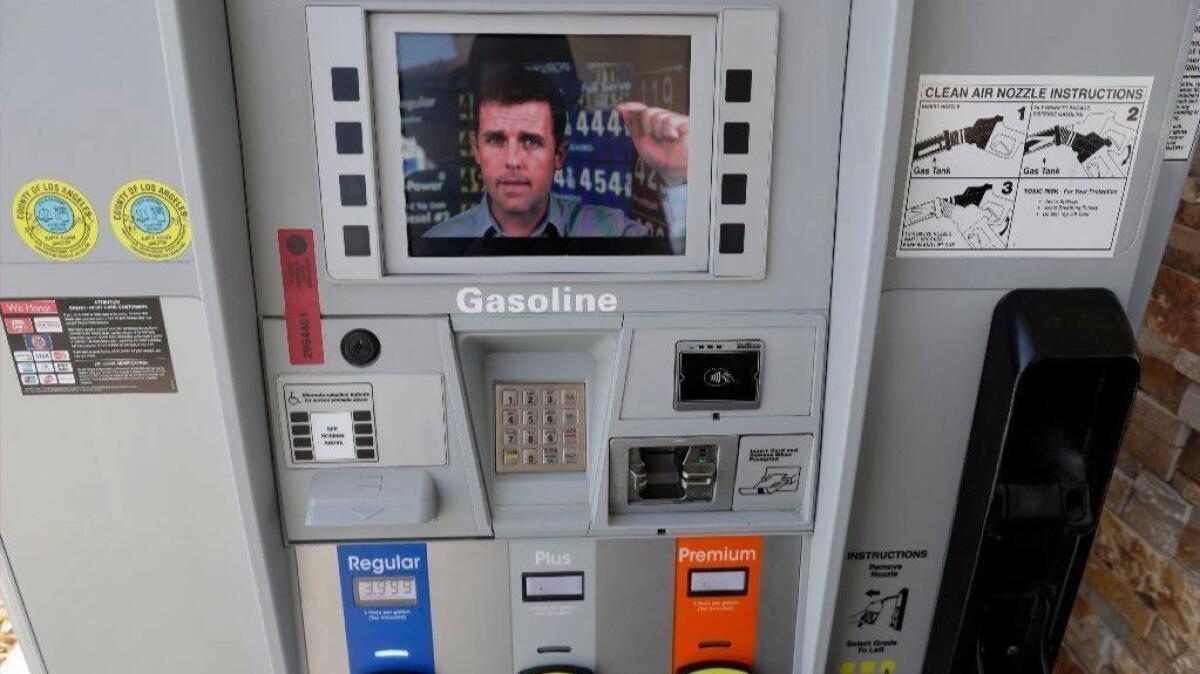 An ad supporting Proposition 6 plays on a screen on a pump at a gas station in Santa Clarita on Oct. 24.