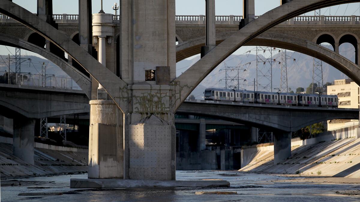 A Metro Gold Line train crosses the Los Angeles River near downtown L.A.