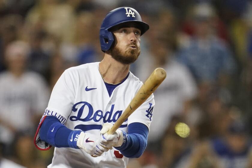 Los Angeles Dodgers' Cody Bellinger watches his grand slam during the eighth inning.