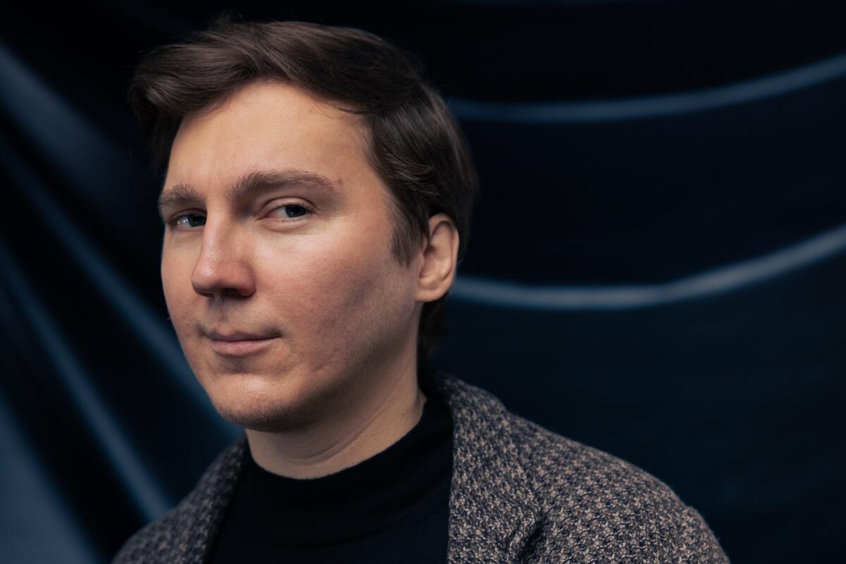 Actor Paul Dano wears a black short and sport jacket for a portrait.