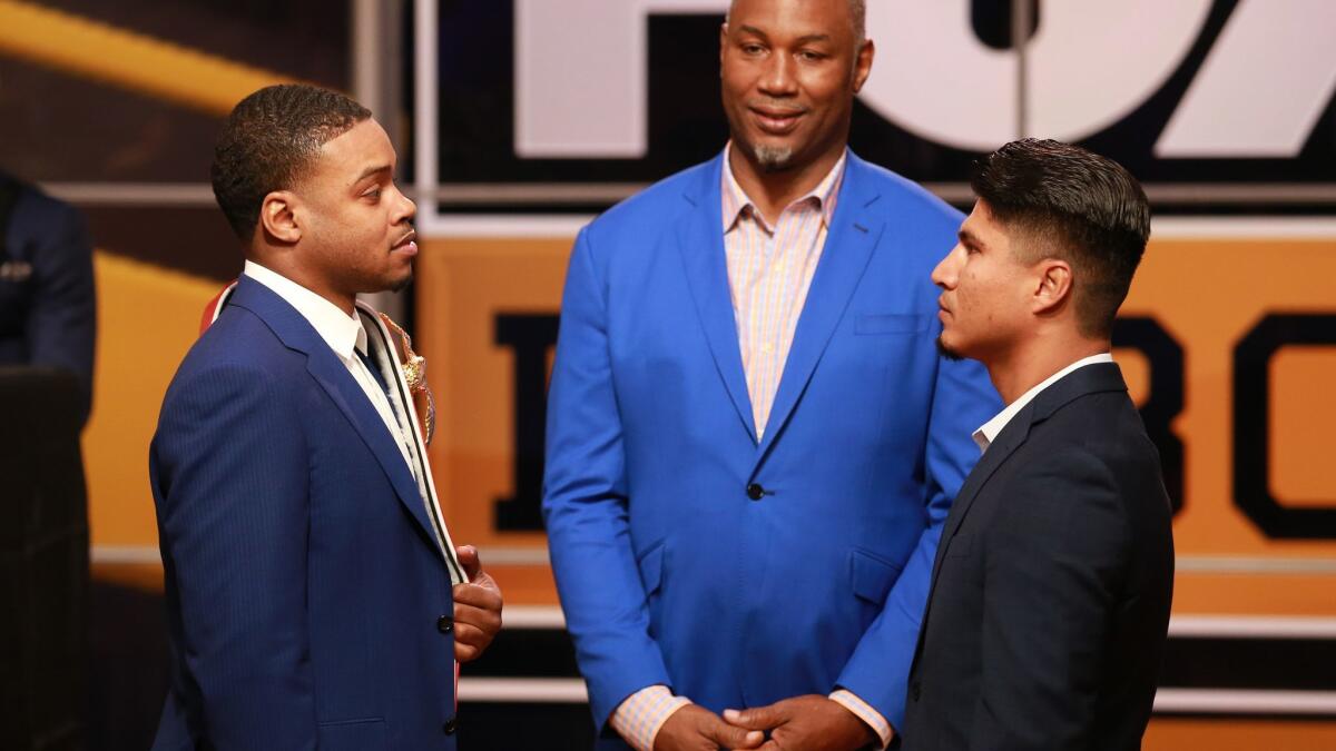 Errol Spence Jr. and Mikey Garcia face off at the announcement of their 2019 fight by FOX Sports and Premier Boxing Champions on Tuesday in Los Angeles. Former champion Lennox Lewis also was in attendance.