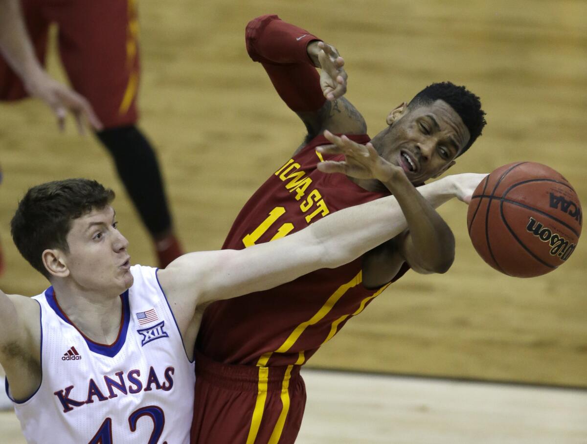 Iowa State guard Monte Morris (11) is fouled by Kansas forward Hunter Mickelson in the second half Sunday.