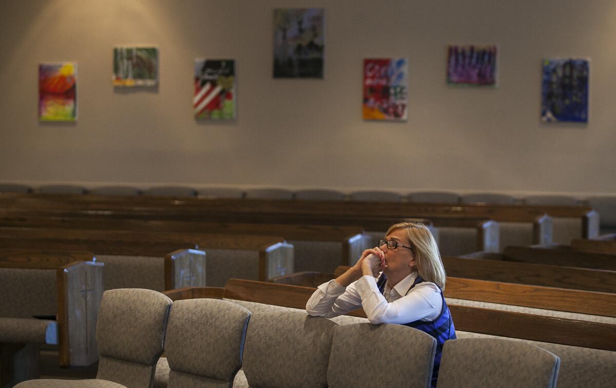 Charlene Ashendorf prays at the Presbyterian Church of the Convenant on Monday. The church hosted a nonpartisan prayer session one day before the mid-term elections.
