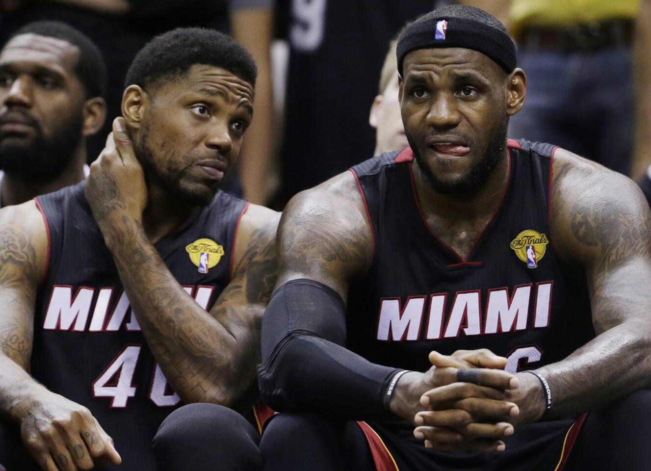 Miami Heat forward Udonis Haslem (40) and LeBron James (6) watch action against the San Antonio Spurs from the bench during the second half in Game 5 of the NBA basketball finals, on Sunday, June 15, 2014, in San Antonio. The Spurs won the NBA championship 104-87. (David J. Phillip)