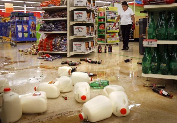Milk jugs and other merchandise litter the aisles at a Kmart in Diamond Bar. (An earlier version of this caption said the Kmart was in Chino Hills.)