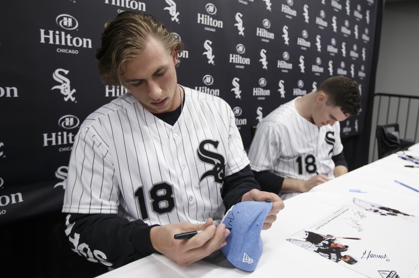White Sox pitcher Michael Kopech, left, signs autographs for fans with White Sox pitcher Zack Burdi during SoxFest 2018 at the Hilton Chicago on Friday, Jan. 26, 2018.