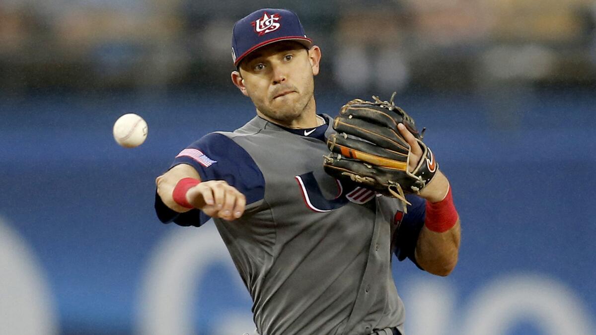 U.S. second baseman Ian Kinsler makes a play against Japan on Tuesday in the World Baseball Classic. Kinsler appears to not be a fan of flamboyant displays of passion in baseball.