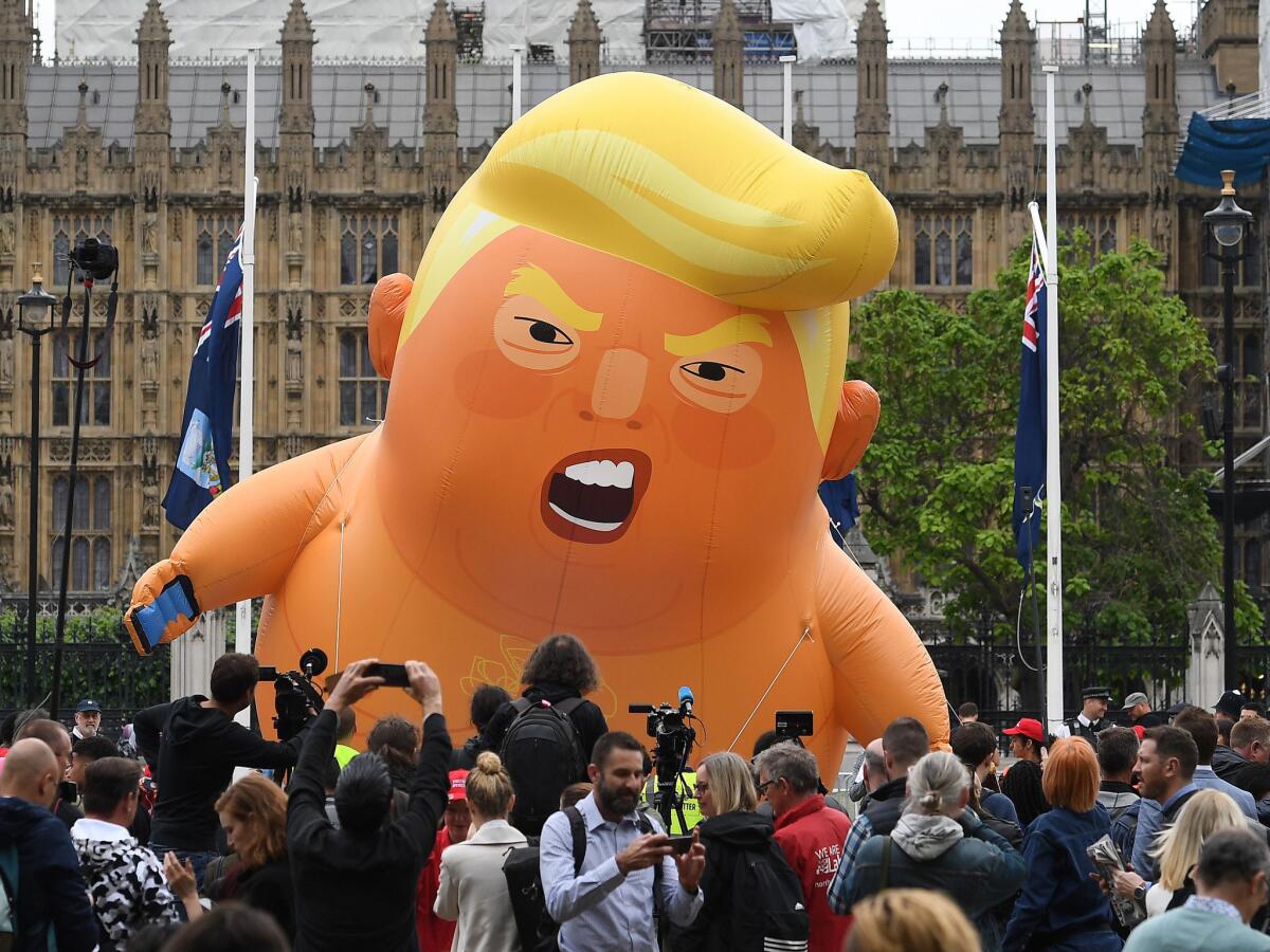 Protesters mock President Trump in London.