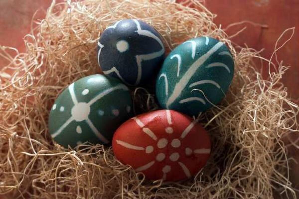 An un-dyeing process is used to create patterns on these Easter eggs.