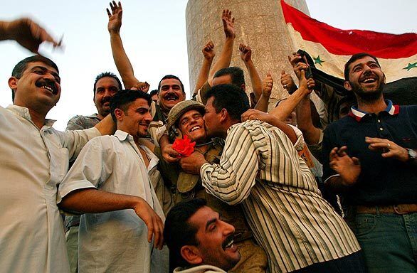 Iraqis celebrate Hussein's ouster