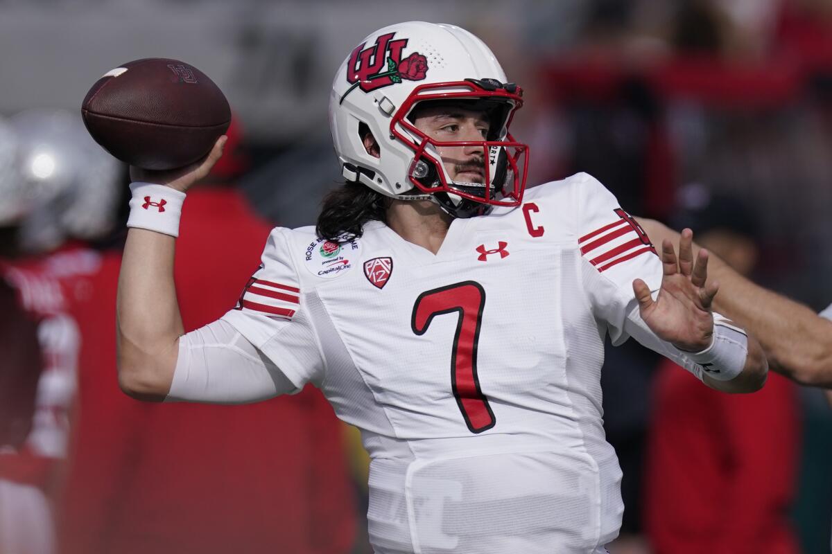FILE - Utah quarterback Cameron Rising warms ups before the Rose Bowl NCAA college football game against Ohio State, Saturday, Jan. 1, 2022, in Pasadena, Calif. Rising isn’t facing a battle to be Utah’s starting quarterback heading into a new season. Rising cemented his spot atop the depth chart when he led the Utes to their first ever Pac-12 championship and Rose Bowl berth a season ago. (AP Photo/Mark J. Terrill, File)