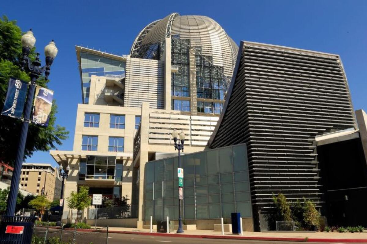 The San Diego Central Library's metallic dome is seen atop a series of geometric volumes, some made of poured concrete