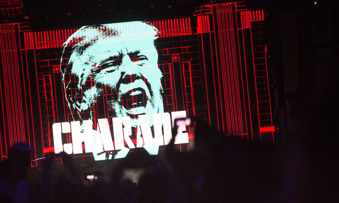 An image of Donald Trump is projected on a large screen during Roger Waters' set at Desert Trip.