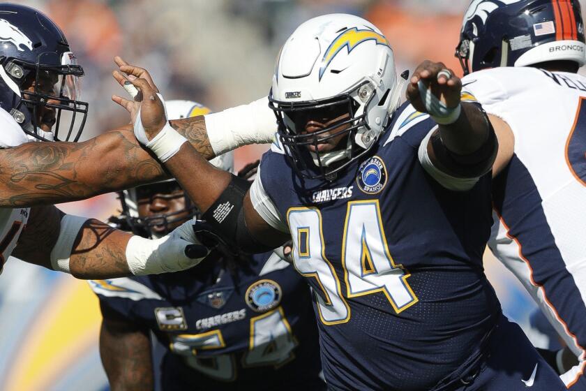 Los Angeles Chargers defensive tackle Corey Liuget (94) runs into the backfield during an NFL football game against the Denver Broncos on Sunday, Nov. 18, 2018 in Carson, Calif. Denver won 23-22. (Peter Read Miller via AP)