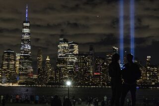 Tribute in Light, two vertical columns of light representing the fallen towers of the World Trade Center shine against the lower Manhattan skyline on the 19th anniversary of the Sept. 11, 2001 terror attacks, seen from Jersey City, N.J., on Friday, Sept. 11, 2020. (AP Photo/Stefan Jeremiah)
