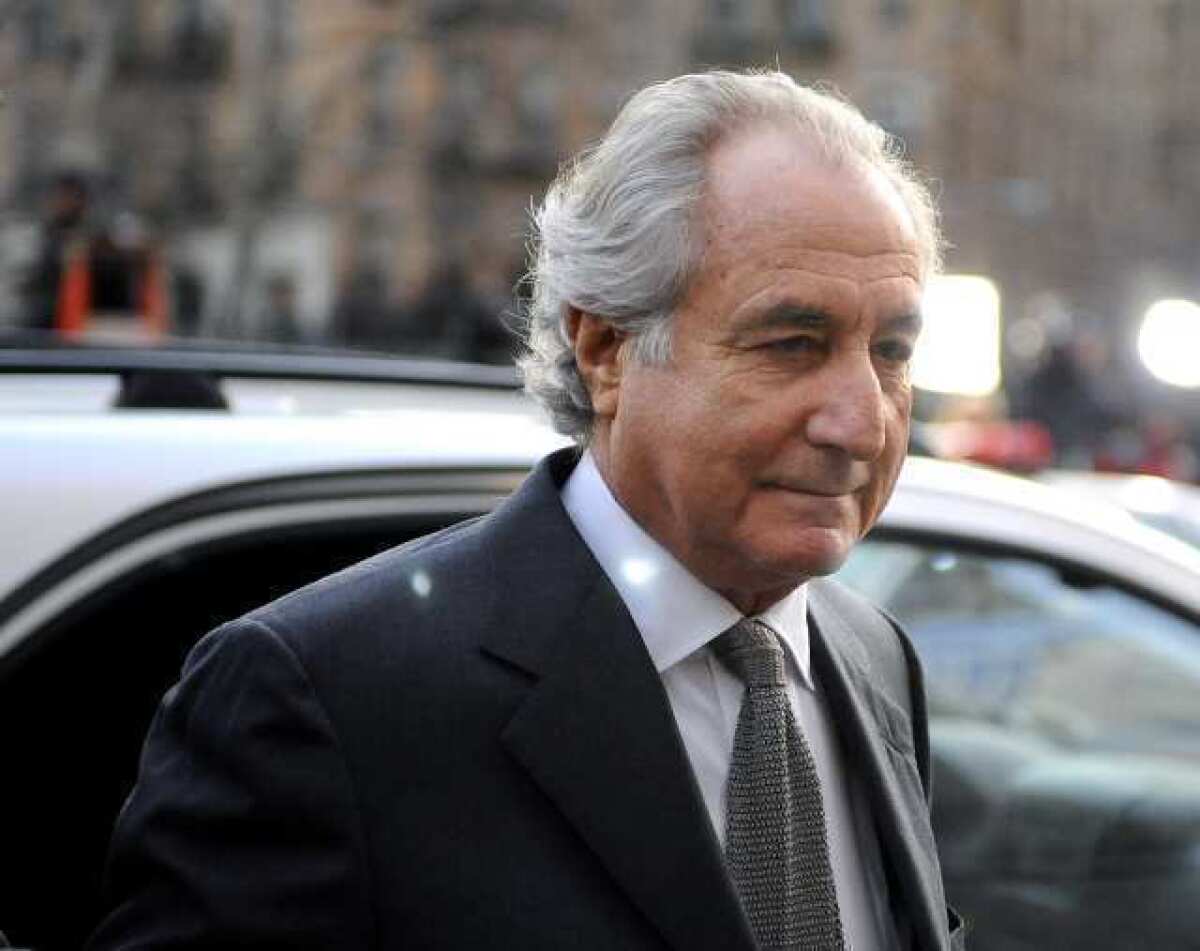 Bernard Madoff arrives at Manhattan federal court on March 12, 2009. His family members and daughters-in-law have been sued for more than $255 million.