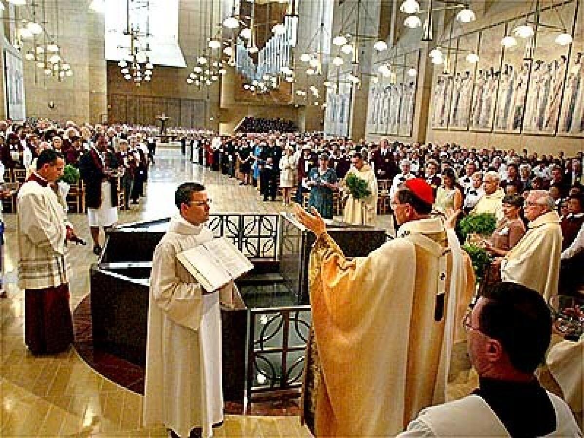 Cardinal Roger M. Mahony officiates at the dedication of the Cathedral of Our Lady of the Angels in downtown Los Angeles. Three thousand invited guests were on hand for the ceremony.