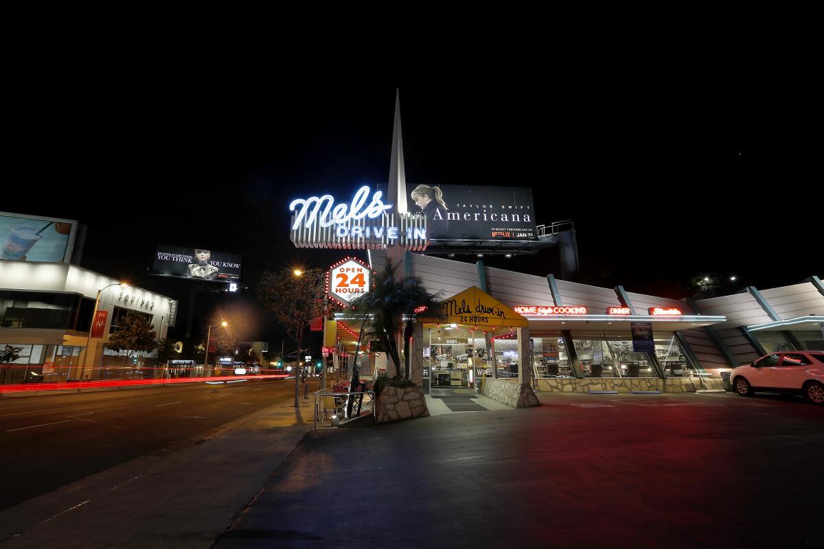 Mel's Drive-In restaurant in West Hollywood remains open by serving takeout and delivery orders even as most businesses on the Sunset Strip have closed to help curb the spread of coronavirus.