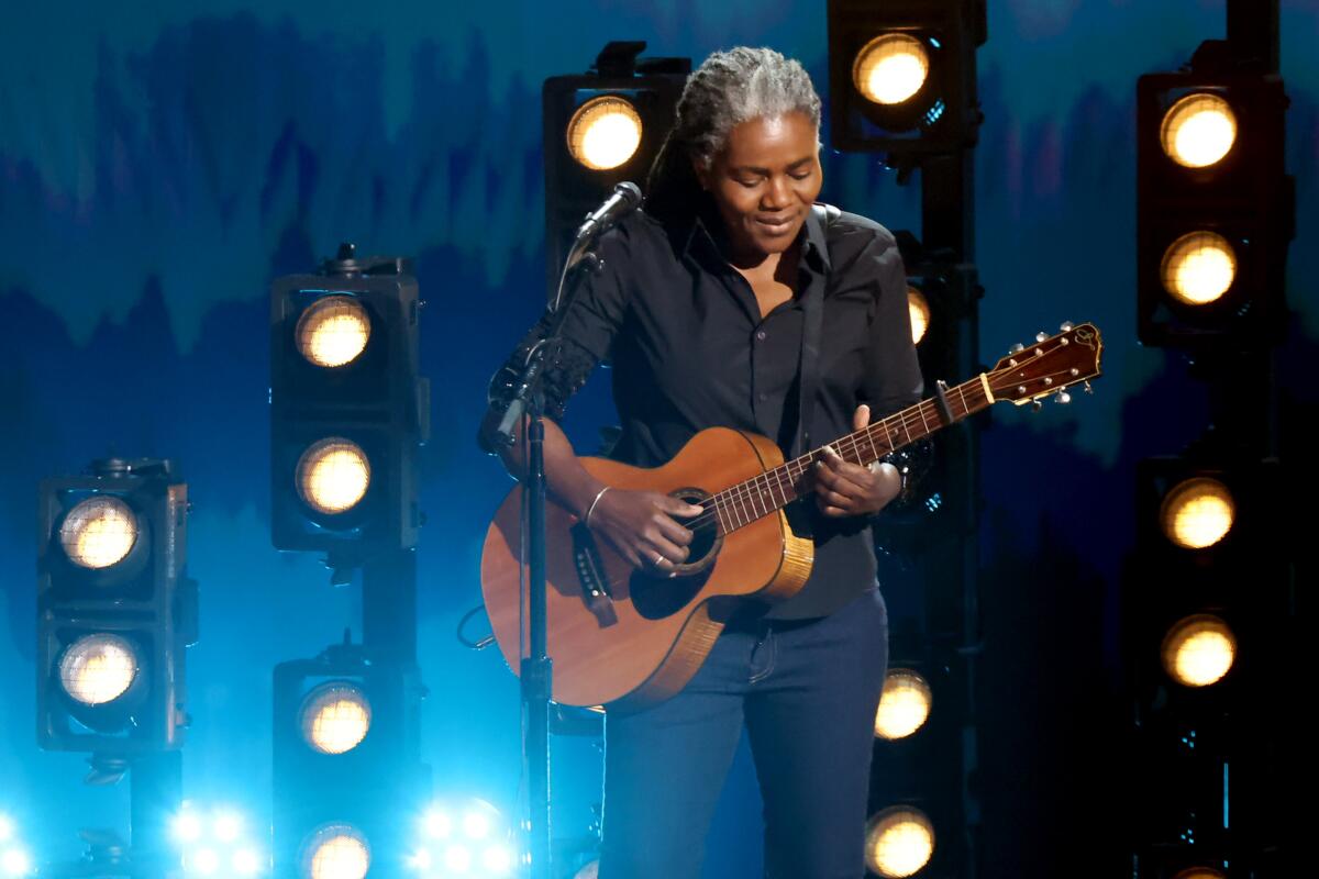 Tracy Chapman onstage, with gray hair