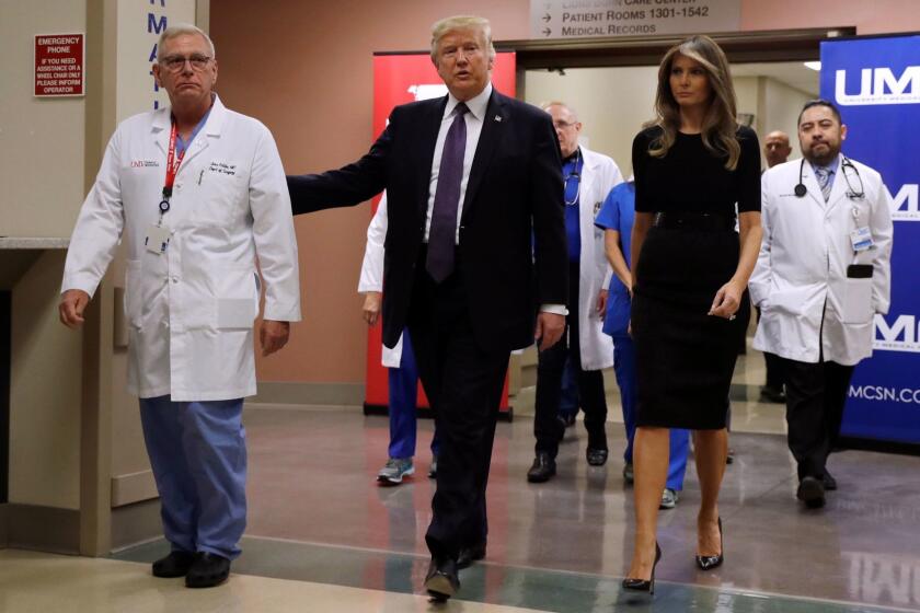 President Trump and first lady Melania Trump with surgeon John Fildes at the University Medical Center.