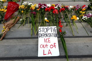 Flowers lay on steps of the Federal Building.