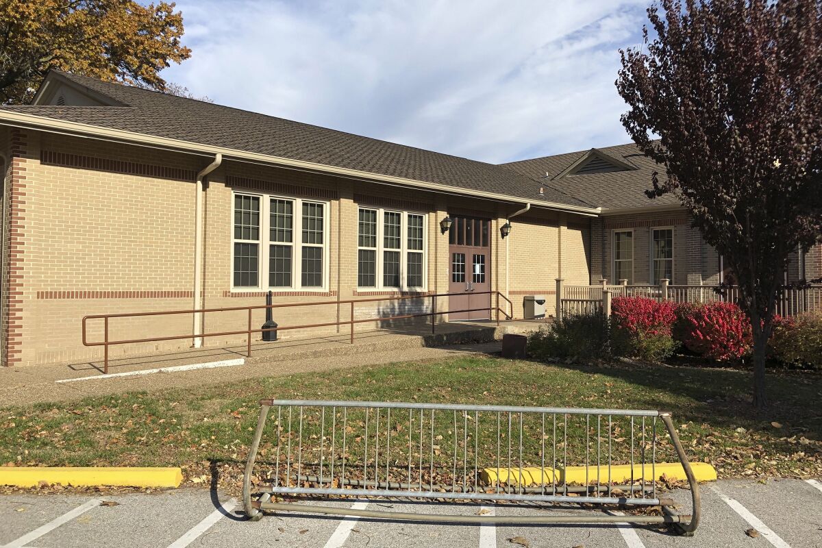 The Blanchette Park Memorial Hall is seen Nov. 5, 2020, in St. Charles, Missouri. A Missouri Poll worker who worked Tuesday at this site had tested positive for COVID-19 Oct. 30 but ignored advice to quarantine and worked anyway. St. Charles County officials say that worker later died. St. Charles County, Missouri, spokeswoman Mary Enger said in a news release Thursday that the person whose cause of death is not yet known was an election judge supervisor. (AP Photo by Jim Salter)