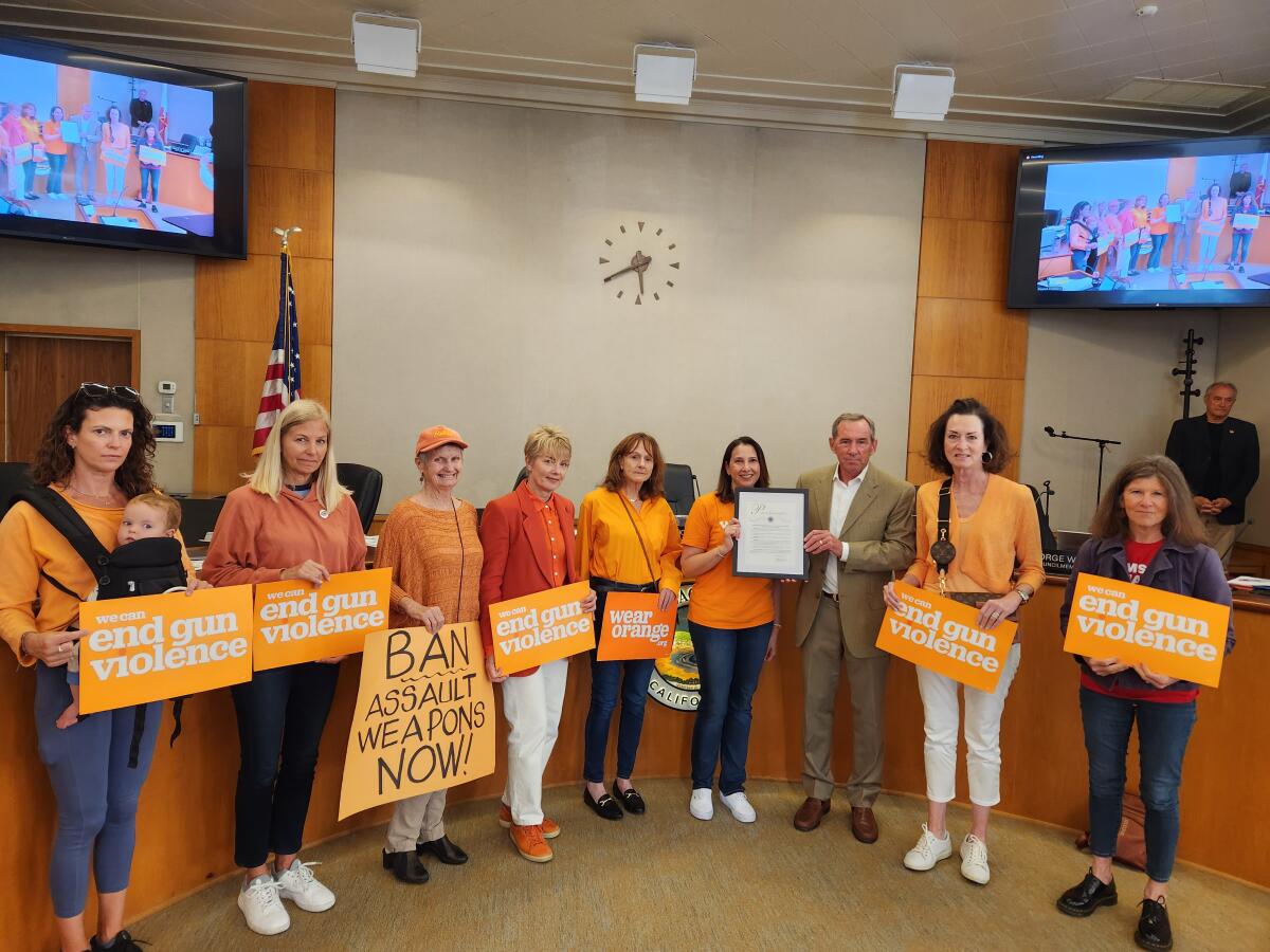 Moms Demand Action members advocate against gun violence at the Laguna Beach City Council meeting on Tuesday.