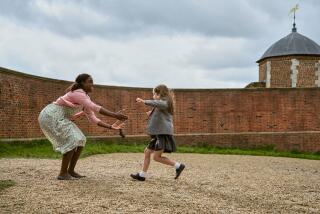 Roald Dahl's Matilda the Musical. (L to R) Lashana Lynch as Miss Honey, Alisha Weir as Matilda in Roald Dahl's Matilda the Musical. Cr. Dan Smith/Netflix © 2022